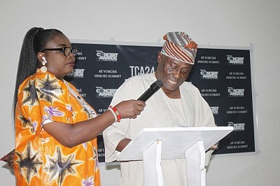 Dr. Abdulai Oluwatoyin Peregrino-Brimah MBBCh, W.A.C.S Ophthalmology presenting a speech at a Management meeting of the TC Awards 2024: All Yoruba Heroes Summit